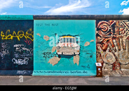 BERLIN, GERMANY - JUNE 10: painting from Birgit Kinder of the Trabant in The East Side Gallery - the largest outdoor art gallery Stock Photo