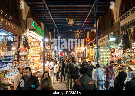Spice Bazaar Street Scene Istanbul Turkey | ISTANBUL, Turkey — A street inside the Spice Bazaar (Mısır Çarşısı, also known as the Egyptian Bazaar) in Istanbul's Eminönü district near the Galata Bridge. The L-shaped covered market was built in the early 1660s as the commercial arasta of the New Mosque külliye endowed by Valide Sultan Turhan Hatice Sultan, making it the third great covered bazaar of Ottoman Istanbul after the Grand Bazaar and the Tiryaki Bazaar at the Süleymaniye complex. Its roughly 88 historic vaulted shops trade in spices, dried fruit, nuts, confectionery, and an increasing s Stock Photo