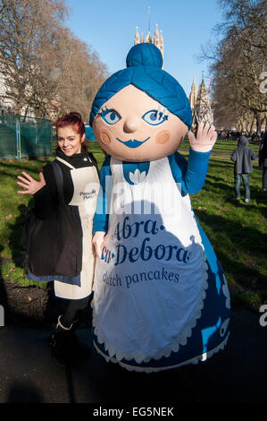 London, UK. 17th February, 2015.   MPs, Lords and members of the Parliamentary Press Gallery take part in the annual, charity Parliamentary Pancake Race in Victoria Tower Gardens, next to the Houses of Parliament on Shrove Tuesday.  Pictured: a pancake sponsor dressed in a costume. Credit:  Stephen Chung/Alamy Live News Stock Photo