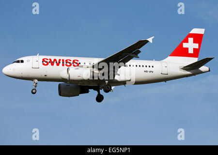 Swiss International Airlines Airbus A319 approaches runway 27L at London Heathrow airport. Stock Photo