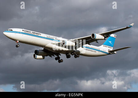 Kuwait Airways Airbus A340-300 approaches runway 27L at London Heathrow airport. Stock Photo