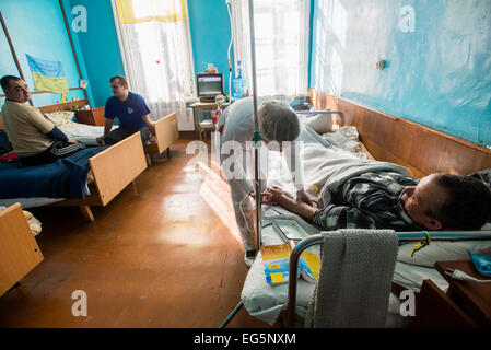 ATO soldiers getting medical treatment in Military Hospital, Ukraine. During Ukrainian-Russian conflict military hospitals overloaded for more than 30%. Most of clinics work with old soviet medical equipment, and lack of modern machines such as tomographs. 16 of February. Photo by Oleksandr Rupeta Stock Photo