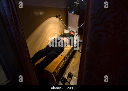 Soldier getting thermotherapy in Military Hospital, Ukraine. During Ukrainian-Russian conflict military hospitals overloaded for more than 30%. Most of clinics work with old soviet medical equipment, and lack of modern machines such as tomographs. 16 of February. Photo by Oleksandr Rupeta Stock Photo