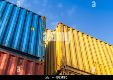 Colorful metal Industrial cargo containers are stacked in the storage area Stock Photo