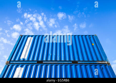 Blue steel Industrial cargo containers are stacked in the storage area Stock Photo