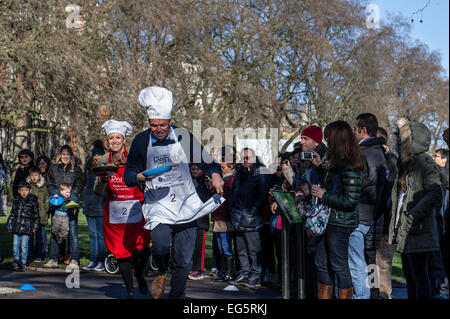 London, UK. 17th February, 2015. ‘The Parliament Tossers’ take on the Media in the Rehab Parliamentary Pancake Race.  The annual contest is sponsored by Harris Fowler, the Personal Injury Solicitors and features Lords, MPs and members of the parliamentary press corps battling it out for the Race Magnificent Tin Cup.  © Gordon Scammell/Alamy Live News Stock Photo
