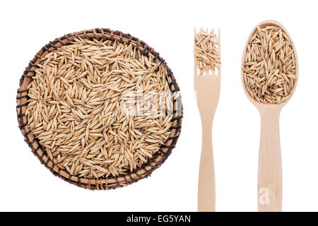 Oats in a plate, fork and spoon, isolated on white background Stock Photo
