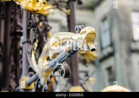 Spout of a gold water fountain Stock Photo