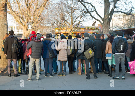 Back View of people watching entertainers at the Embankment London UK Stock Photo
