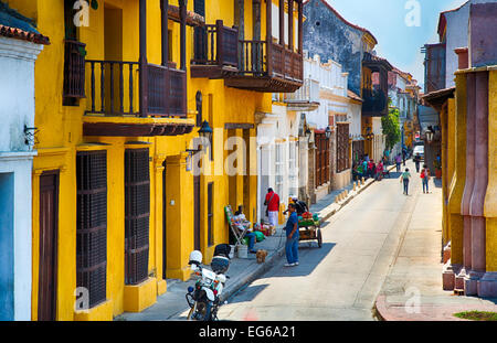 Cartagena, Colombia - February 22, 2014 - Tourists and locals walk through the picture perfect streets of Cartagena. Stock Photo