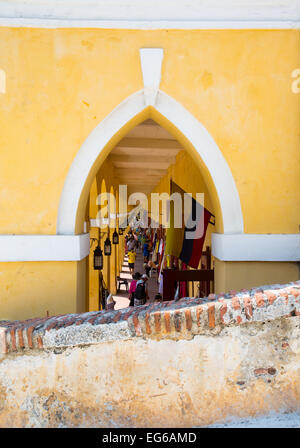 Cartagena, Colombia - February 22, 2014 - Tourists shop in the grand arcades lining the old city walls of Cartagena. Stock Photo