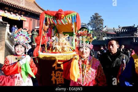 Beijing, China. 18th Feb, 2015. People take part in a traditional blessing ceremony in the Badachu Park in Beijing, capital of China, Feb. 18, 2015. The ceremony was the prelude to the new year temple fair which will be officially open to public on Feb. 19. Credit:  Li Jundong/Xinhua/Alamy Live News Stock Photo