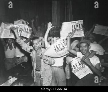Filipinos celebrate headlines, 'Japan Surrenders' at the end of World War 2. August 10-15, 1945. (BSLOC 2014 10 274) Stock Photo
