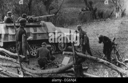 World War 2 combat in Yugoslavia, ca. 1944. German photograph caption 'Eingekesselte Tito-Banden' translates to 'Caught Tito Stock Photo