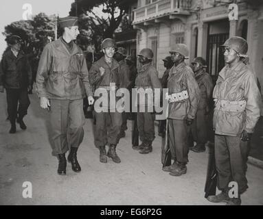 General Mark Clark, inspects the 92nd Infantry Division on Nov. 15, 1944. The Buffalo Soldiers, a traditional African American Stock Photo