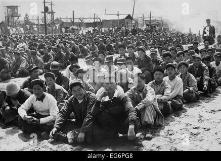 North Korean and Chinese Communist prisoners assembled in a UN POW camp at Pusan, Korea. April 1951. Korean War, 1950-53. Stock Photo