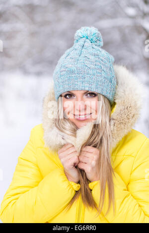 Happy young smiling woman at winter outdoor. Hipster caucasian girl have a fun on winter vacation. Stock Photo
