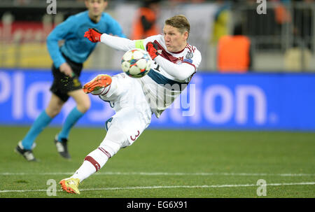 Lviv, Ukraine. 17th Feb, 2015. Munich's Bastian Schweinsteiger controls the ball during the UEFA Champions League Round of 16 first leg soccer match between Shakhtar Donetsk and FC Bayern Munich at the Arena in Lviv, Ukraine, 17 February 2015. Photo: Andreas Gebert/dpa/Alamy Live News Stock Photo