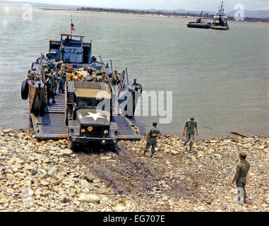 Vung Tau Harbor, Vietnam - September 7, 1966 -- The USNS Daniel I. Sultan, and an escorting baby carrier reaches Vung Tau Harbor, Republic of Vietnam on September 7, 1966 with troopers of the Eleventh Armored Calvary Regiment. Personnel disembark and head for shore in LSUS where military and civilian dignitaries wait to greet them after a 20 day sea voyage from the United States. A GI 2 1/2 ton truck backs into the loading platform of an LSU as more men and equipment arrive to move out to the airbase for the flight to Bien Hoa Airbase. Foto: Peter P. Ruplenas - U.S. Army    (c) dpa - Report    Stock Photo