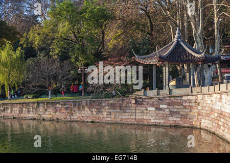 Hangzhou, China - December 5, 2014: traditional Chinese gazebo on the coast in famous West Lake park in Hangzhou city Stock Photo