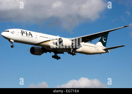 Pakistan International Airlines Boeing 777-300 approaches runway 27L at London Heathrow airport. Stock Photo