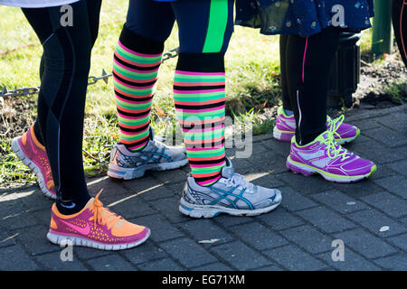 Pancake race women wearing trainers, Olney, Buckinghamshire, England, UK Stock Photo