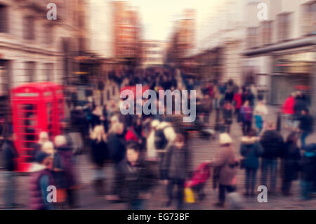 a defocused blur background of people walking in a street in London, United Kingdom Stock Photo