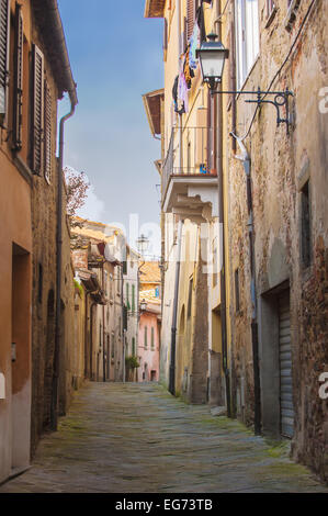 Old streets of greenery a medieval Tuscan town. Stock Photo