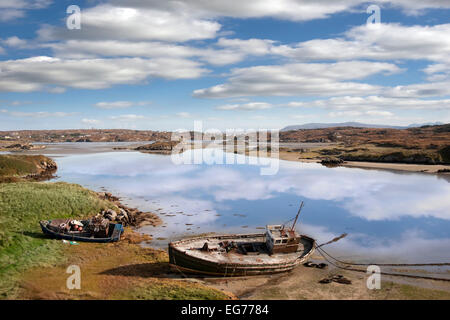 two old fishing boats beached on a coastal beach in county Donegal, Ireland Stock Photo