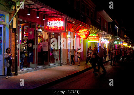 Business on Bourbon Street at night in the French Quarter, New Orleans, Louisiana, USA. Stock Photo