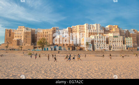 SHIBAM, YEMEN - February, 21: Yemeni boys playing soccer at Shibam, Hadramaut provence, Yemen on February, 21, 2011 Stock Photo