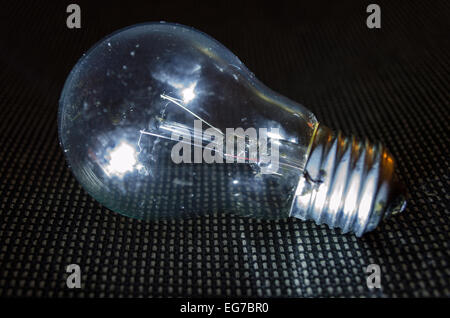 Light bulb on dark background. Stock Photo