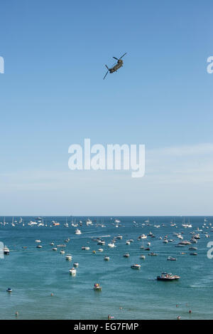 RAF Chinook helicopter over swimmers in sea during Bournemouth Air Festival 2013. Stock Photo