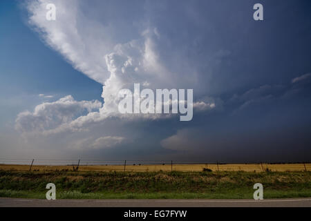 A powerful supercell thunderstorm takes shapes with a twisting updraft ...