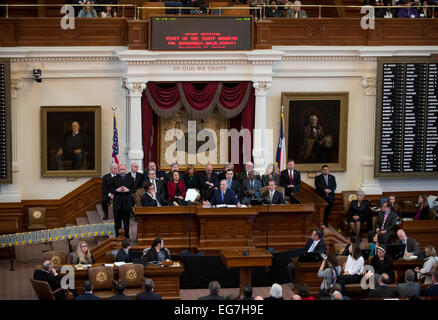 State officials crowd the dais as Texas Gov. Greg Abbott gives his State of the State speech in the House chamber Stock Photo