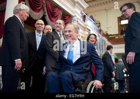 Texas Gov. Greg Abbott rolls his wheelchair down ramp from dais in the Texas House chamber after his State of the State speech Stock Photo