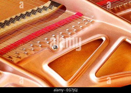 A closeup view of a modern soundboard in a grand piano. Stock Photo