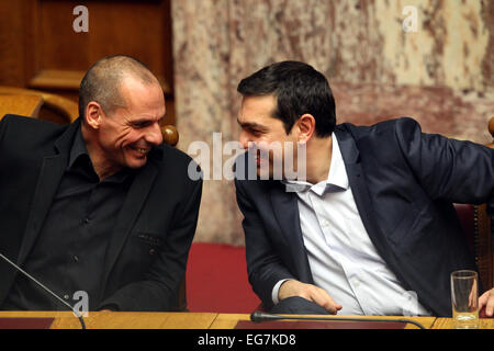 Athens, Greece. 18th Feb, 2015. Greece's Prime Minister Alexis Tsipras (R) and Greece's Finance Minister Yanis Varoufakis smile during a presidential vote in Athens, Greece, Feb. 18, 2015. Prokopis Pavlopoulos, a moderate conservative former Minister of Interior, was elected on Wednesday as the new President of Greece. © Marios Lolos/Xinhua/Alamy Live News Stock Photo