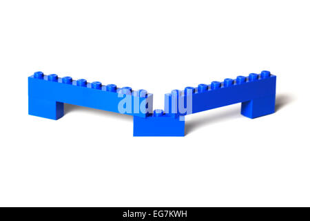 A Lego brick construction, bridge, viaduct, barrier, etc. of blue Lego bricks on white. Stock Photo