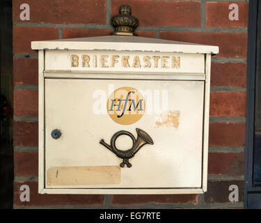 Old mailbox on a red brick wall of a medieval building in Lubeck, Germany , Europe Stock Photo