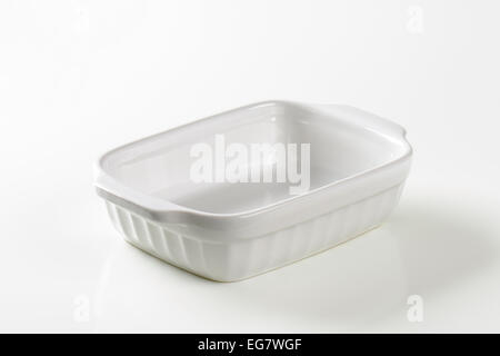 Classic white ceramic casserole dish with handles Stock Photo