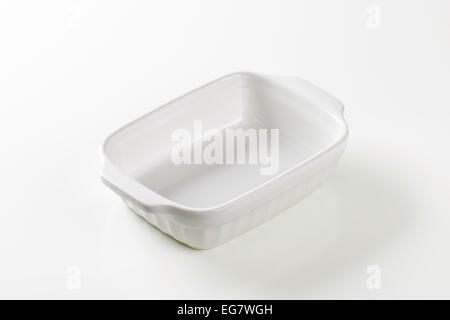 Classic white ceramic casserole dish with handles Stock Photo