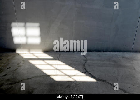 Sunlight from window on the old cement wall Stock Photo