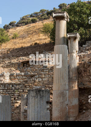 Ancient Ephesus, ruins columns against hill Stock Photo