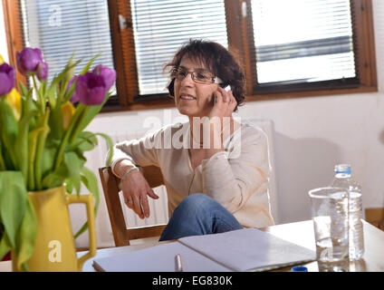 relaxed woman at the office with his mobile phone