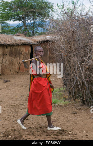 MASAI MARA, KENYA - September, 23: Young Masai woman with ax on September, 23, 2008 in Masai Mara National Park, Kenya Stock Photo