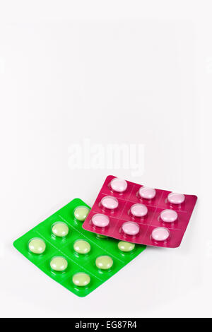 Two kinds of pills on a white background Stock Photo