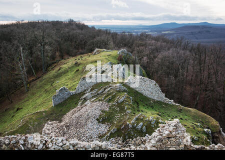 Ruins of the castle Hrusov in deciduous forest and surrounding countryside. Slovak republic, Europe. Stock Photo