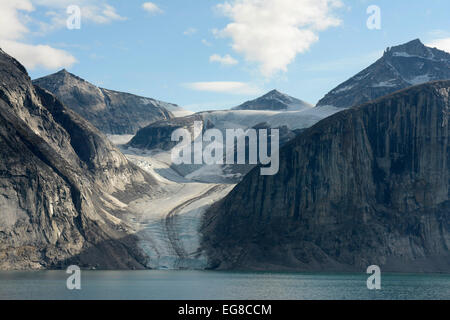 Baffin Island, Nunavut, Canada, showing glacier flowing into the sea, August Stock Photo