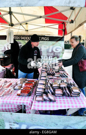 organic bacon sausages and pork produce for sale at a local farmers market Stock Photo